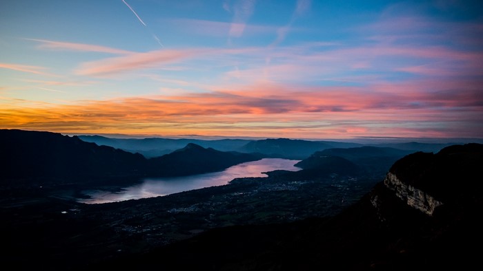 Sunset over a lake and mountains