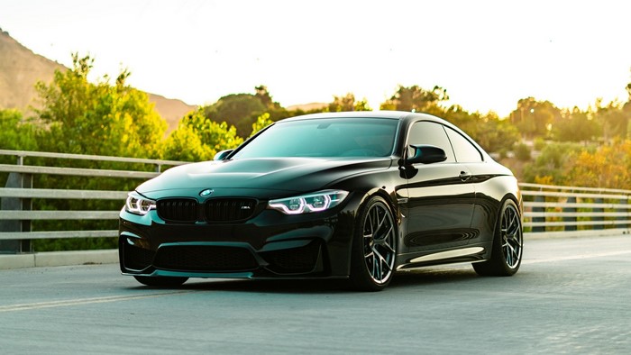 Black BMW F82 M4 Coupe on a bridge
