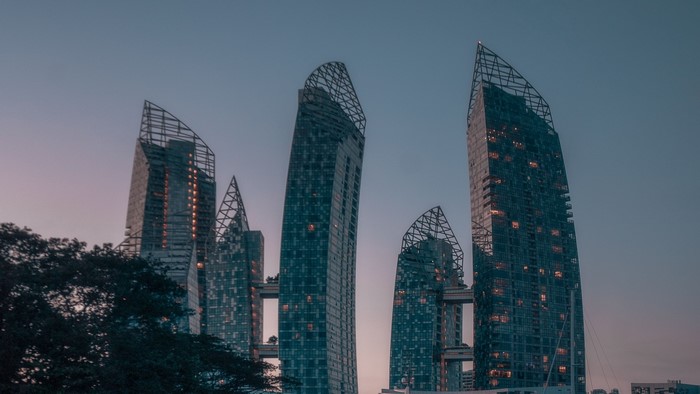 Skyscrapers at dusk with connecting bridges