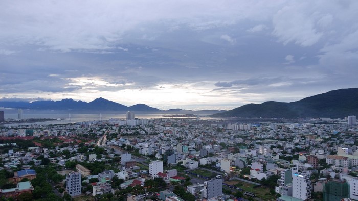 Urban landscape with mountains and sea