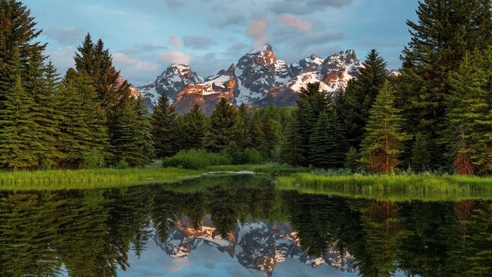 Grand Teton Mountains reflected in a calm lake