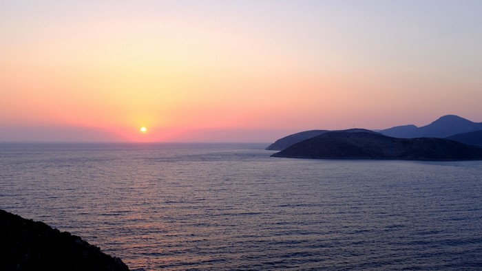 Sunset over the sea with islands