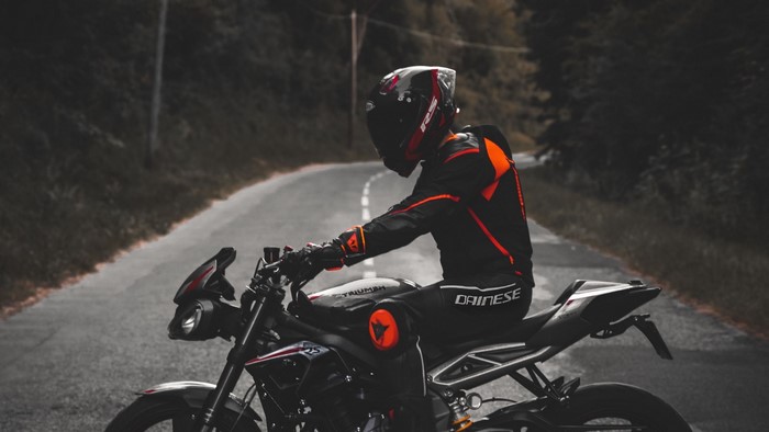 Motorcyclist on a Triumph motorcycle on a road