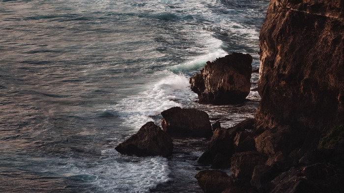 Waves crashing on rocky shore