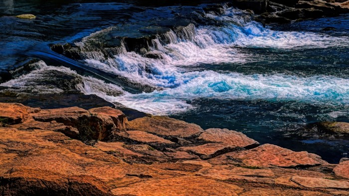 River rapids flowing over rocks