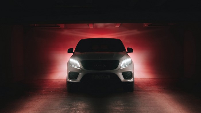 Mercedes-Benz GLE 350d parked in a garage with red lighting
