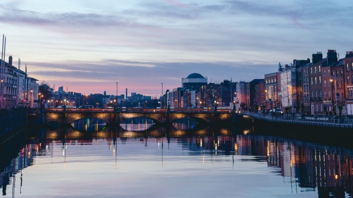 River and bridge at dusk in a city