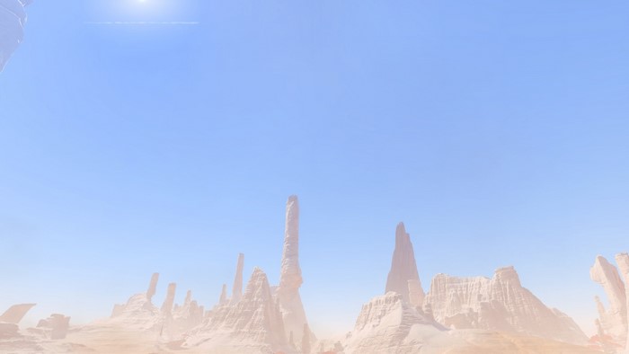 Desert rock formations under a bright sky