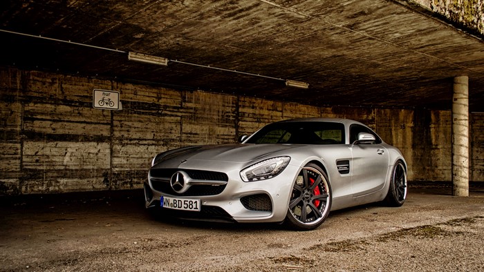 Silver Mercedes-AMG GT S parked in a concrete structure