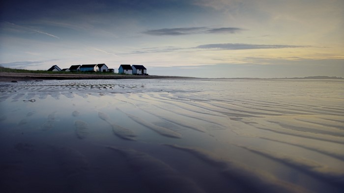Beach houses at low tide