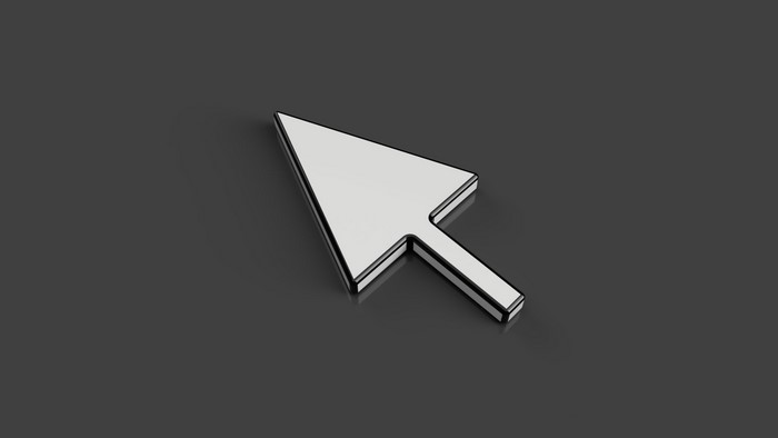 White computer cursor on a dark background