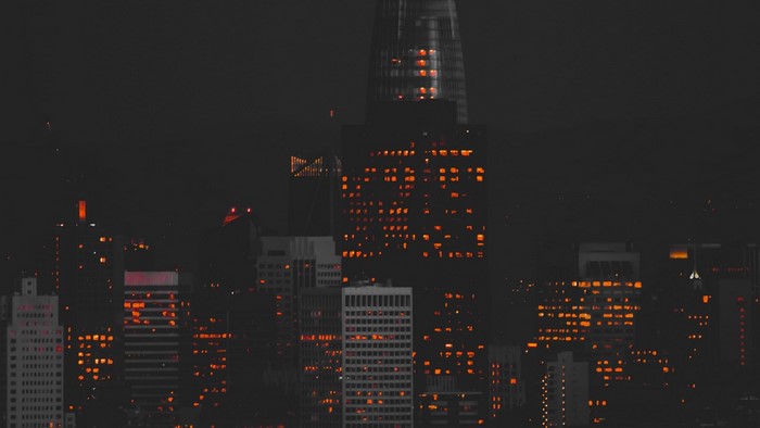 Night city skyline with illuminated skyscrapers