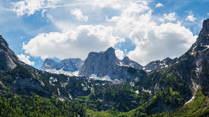 Majestic mountain range under a cloudy sky