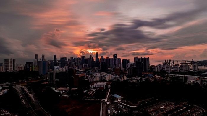 Cityscape at Sunset with Dramatic Clouds