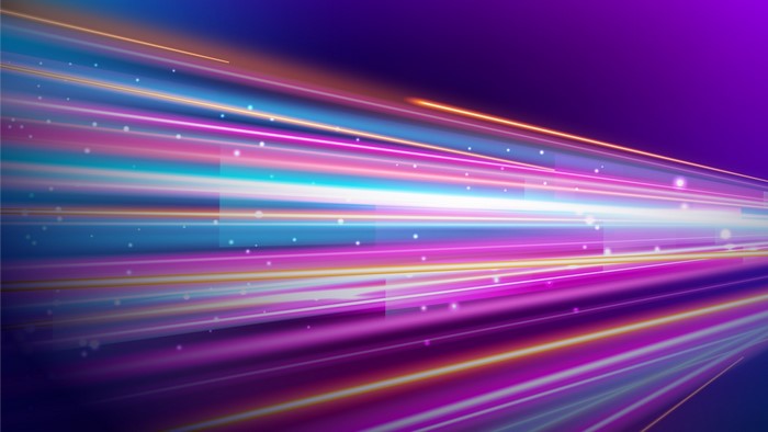 Abstract light streaks on purple background