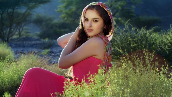 Girl in a pink dress and headscarf outdoors