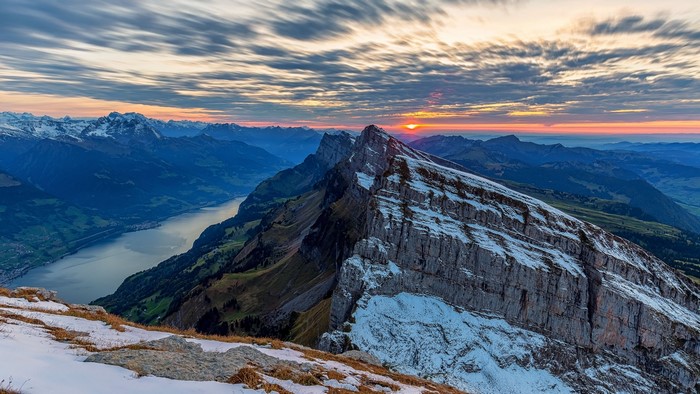 Mountain range with lake at sunrise