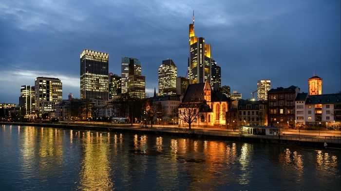 Night cityscape with river reflection