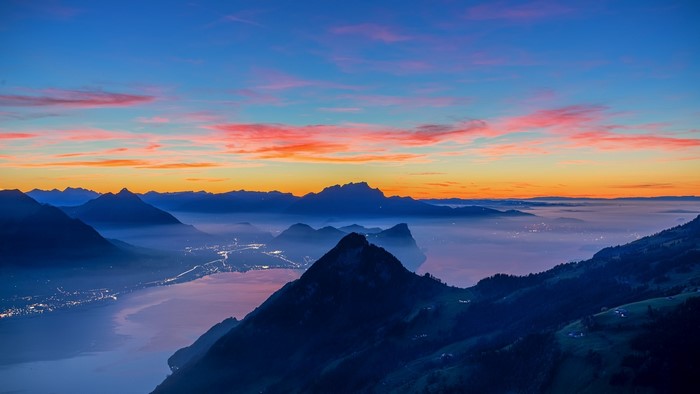 Mountain lake at sunrise with colorful sky