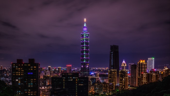 Night cityscape with illuminated Taipei 101 skyscraper