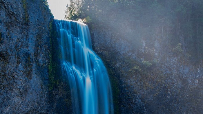 Waterfall cascading down a rocky cliff face