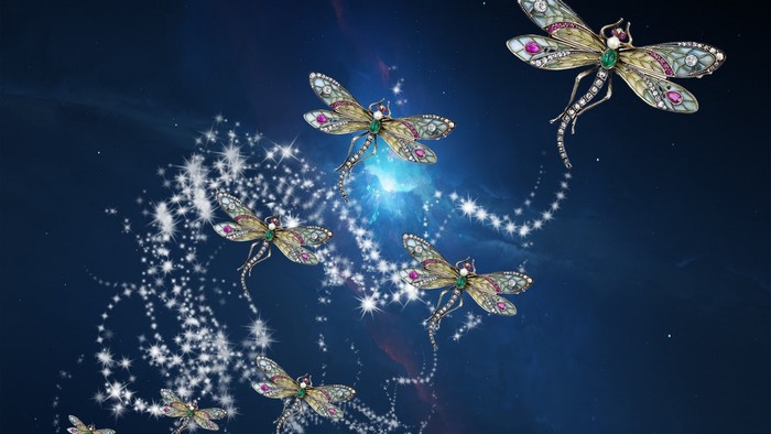 Jeweled dragonflies with sparkling trails on a starry background