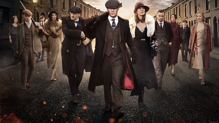 Peaky Blinders characters walking down a street