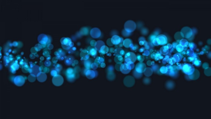 Blue and teal bokeh lights on dark background