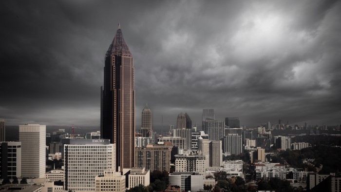 Atlanta skyscrapers under stormy clouds