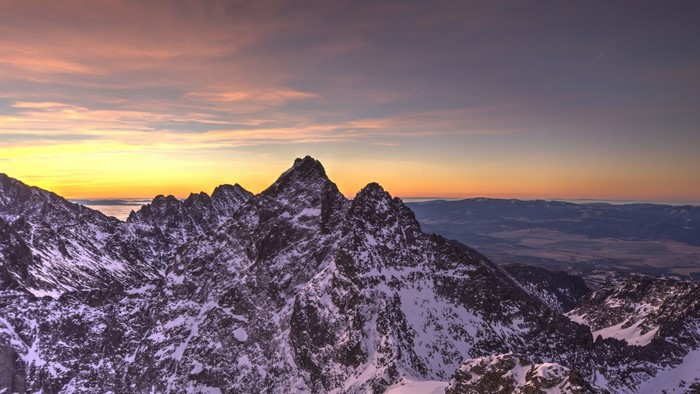 Snow-covered mountains at sunrise