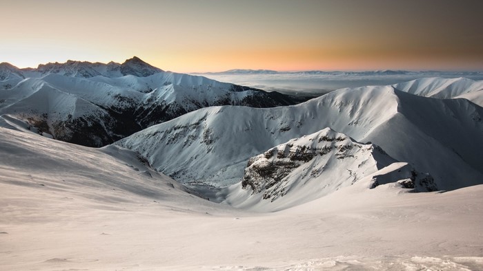Snowy mountains at sunset