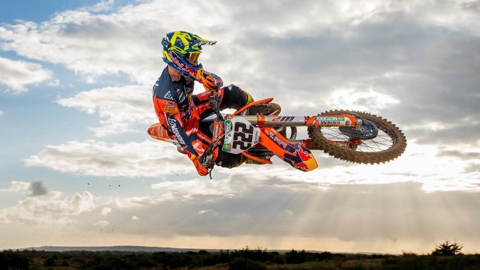 Motocross Rider Number 222 in Mid-Air Jump