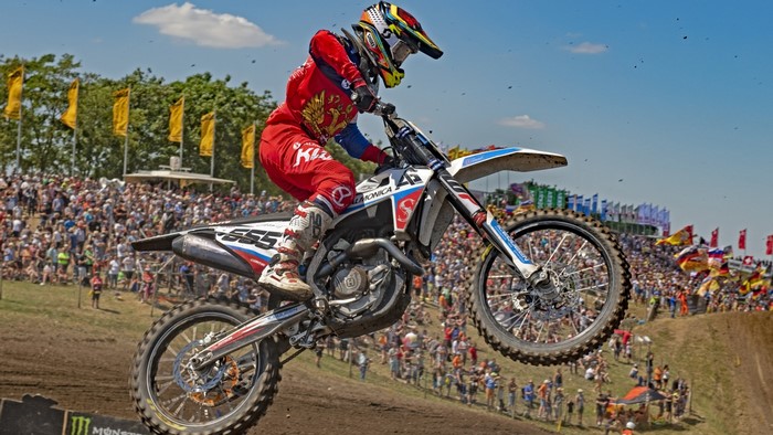 Motocross rider 555 in action at MXGP
