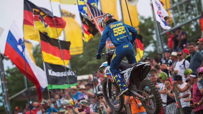 Motocross rider Guryev 555 in action
