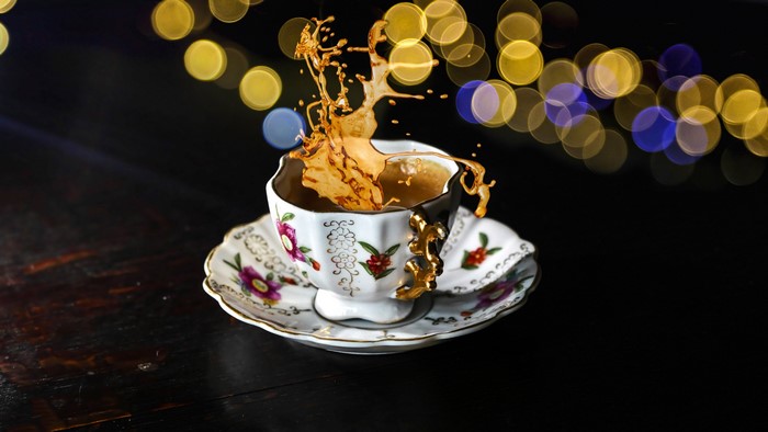 4K Still life of coffee splash in a teacup