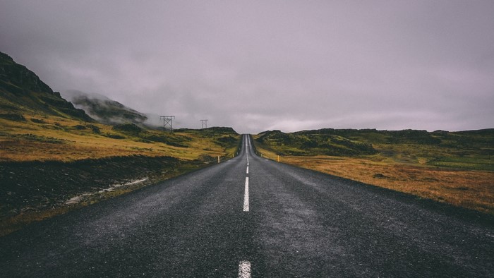 Empty road through a mountainous landscape