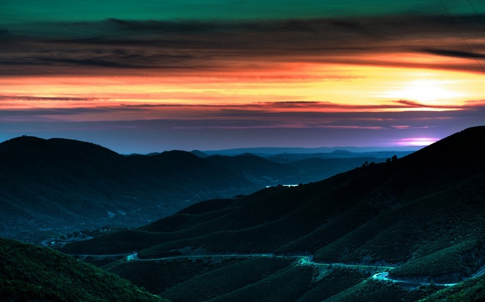 Mountain landscape at sunset with colorful sky