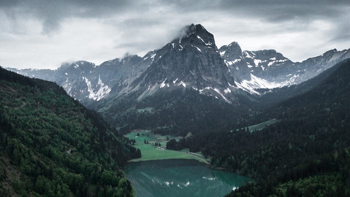 Mountain valley with lake and forest