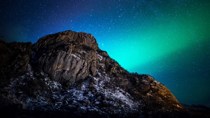 Mountain under the Aurora Borealis