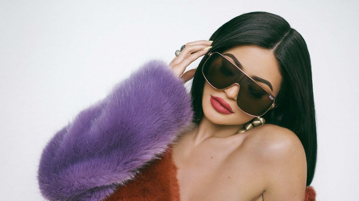 Kylie Jenner wearing sunglasses and fur coat