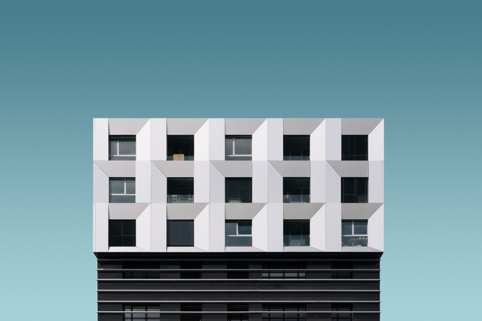 Geometric building facade with repeating window patterns
