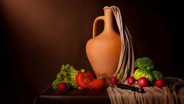 Still life with terracotta jug and vegetables