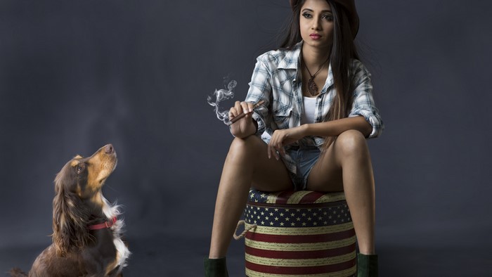 Girl with cigar and dog