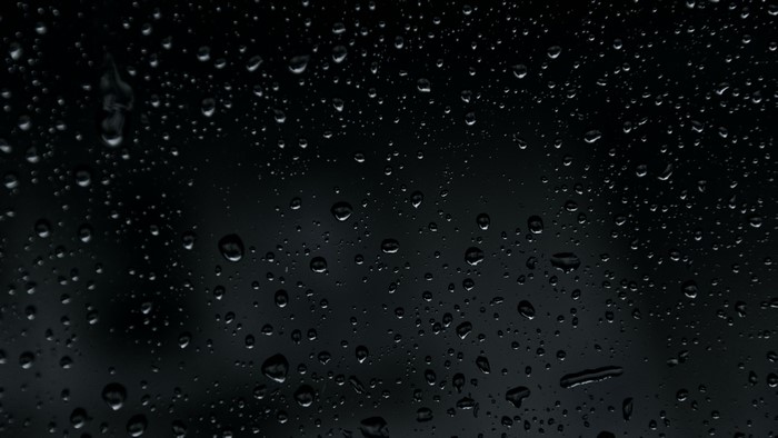 4K Water Drops on Dark Surface