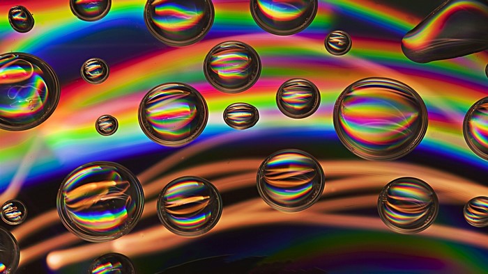 Water Drops on Rainbow Background