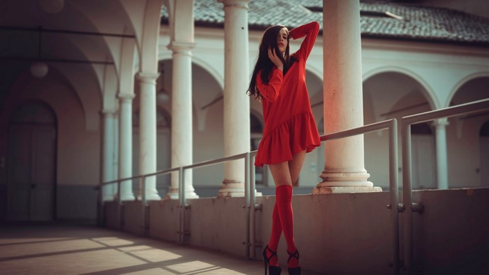 Woman in red dress and stockings
