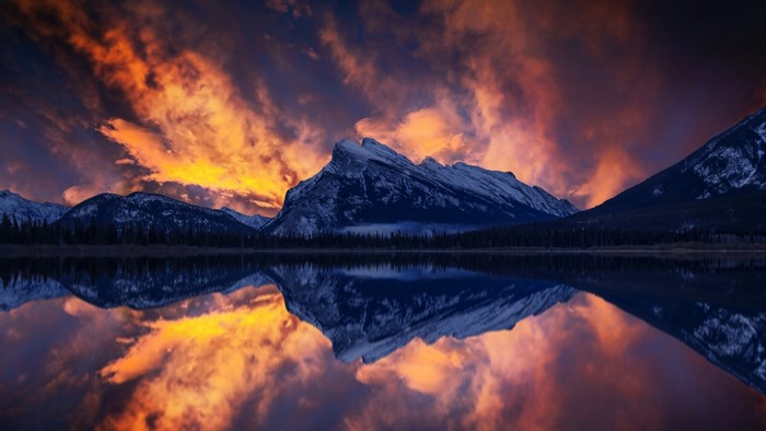 Sunset over mountains reflected in a lake