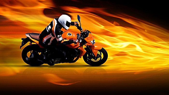Motorcyclist in Orange Gear on Orange Motorcycle with Flames