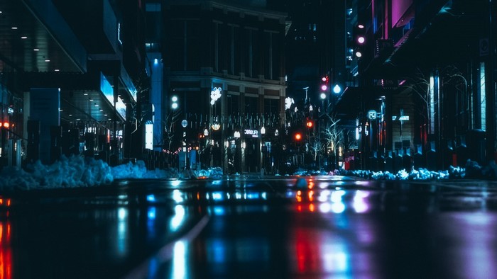 Night city street with reflections