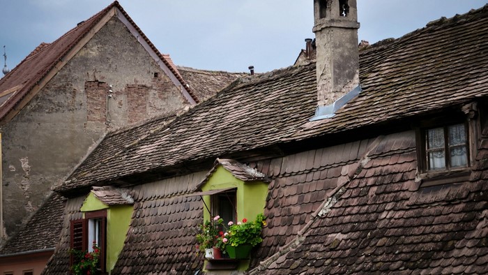 Old tiled roofs with dormer windows and chimney